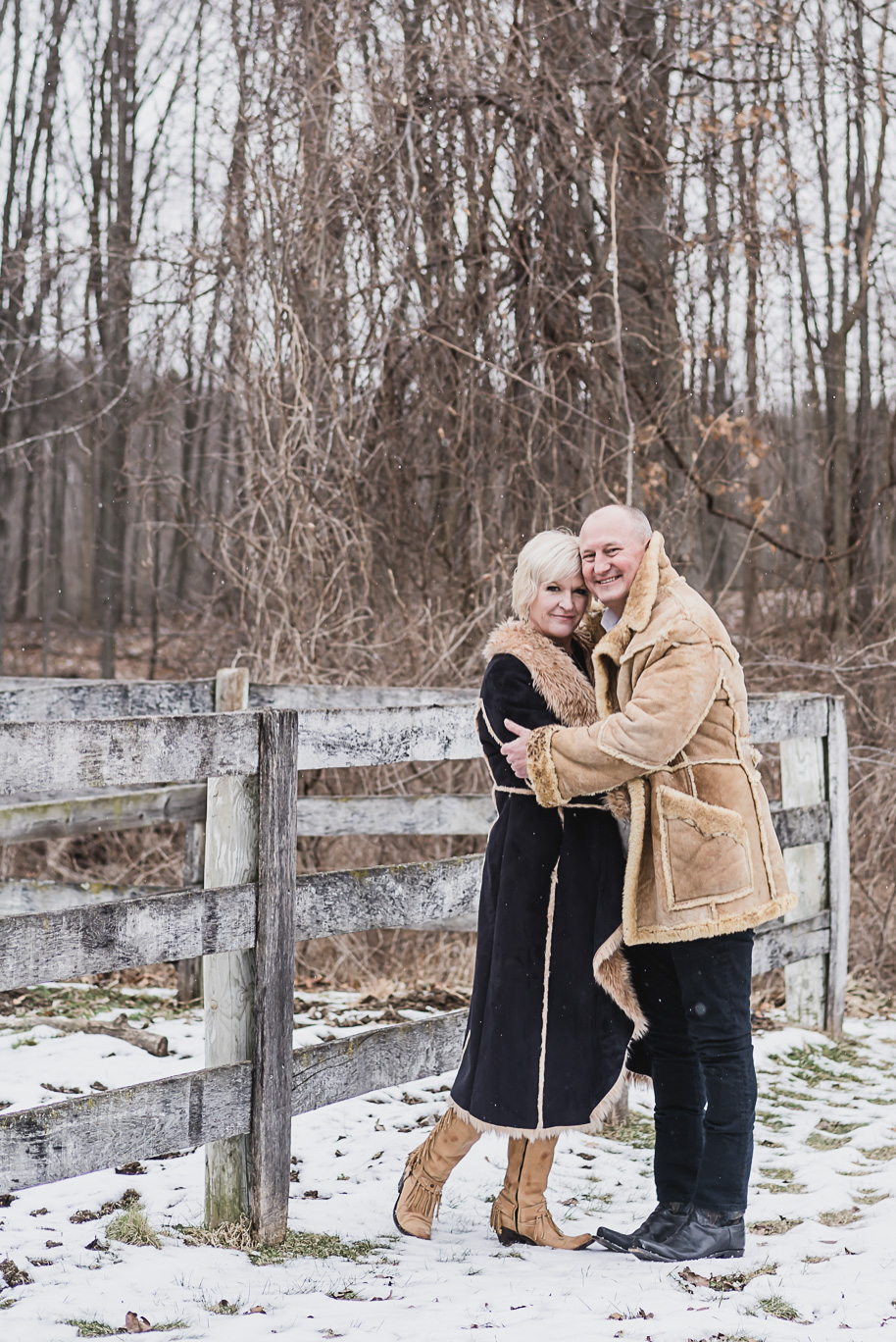 Snowy winter engagement photos in Romeo, Michigan provided by Kari Dawson, top-rated Southeastern Michigan wedding and engagement photographer.