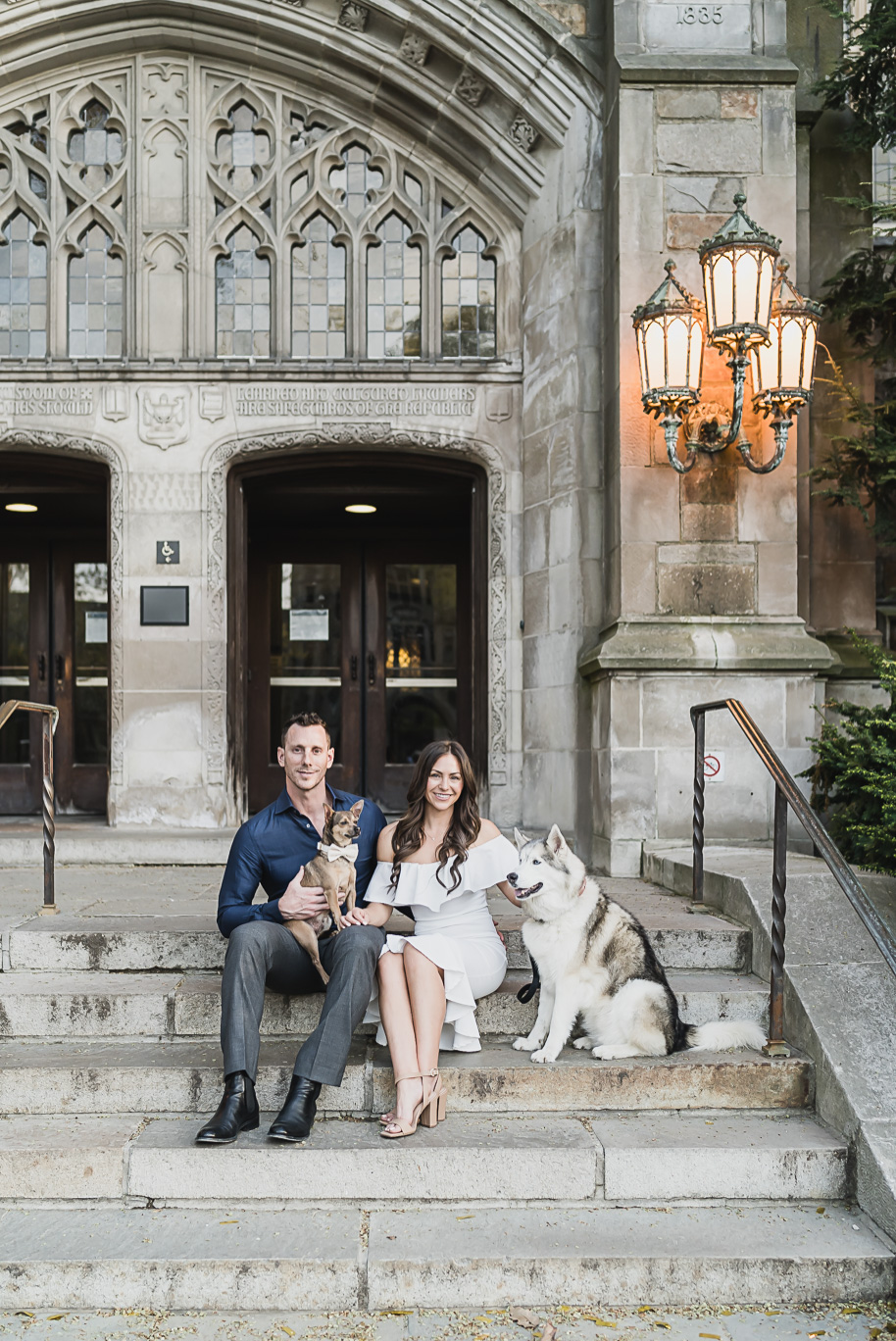 Classic Ann Arbor Engagement photos at the Law Quad with stunning architecture and blooming trees by Kari Dawson Photography.