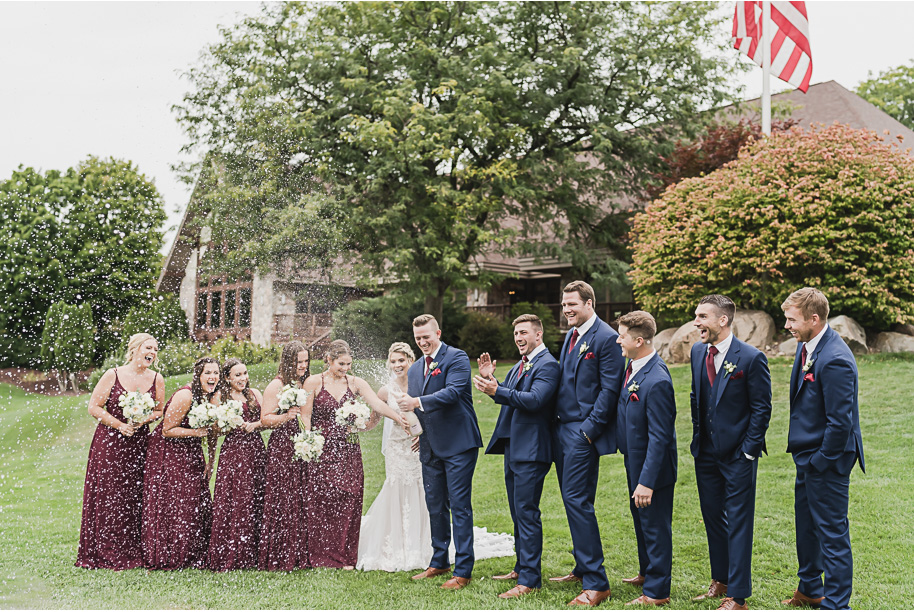 A navy and cranberry fall Lapeer Country Club wedding in Lapeer, Michigan provided by Kari Dawson, top-rated Northern Michigan wedding photographer, and her team.