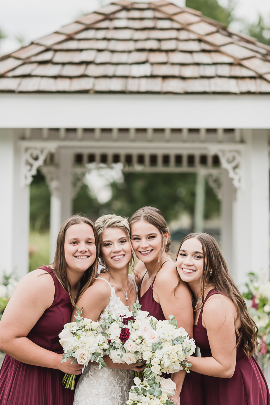 A navy and cranberry fall Lapeer Country Club wedding in Lapeer, Michigan provided by Kari Dawson, top-rated Northern Michigan wedding photographer, and her team.
