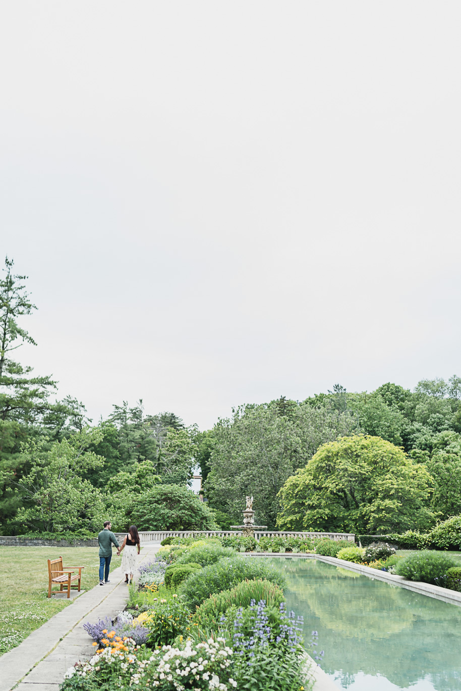 A romantic summer Cranbrook House and Gardens engagement session in the summer by top-rated Detroit wedding photographer Kari Dawson.