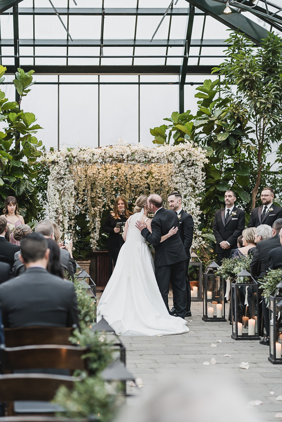 A lilac and black classic winter Planterra wedding in West Bloomfield, Michigan provided by Kari Dawson, top-rated Detroit wedding photographer.