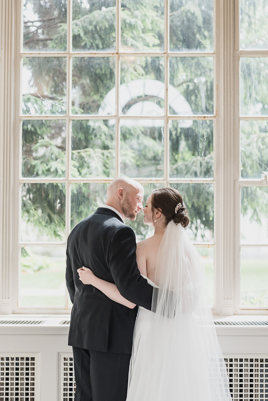 A spring black and white Lovett Hall wedding at Greenfield Village in Dearborn, Michigan provided by Kari Dawson Photography.