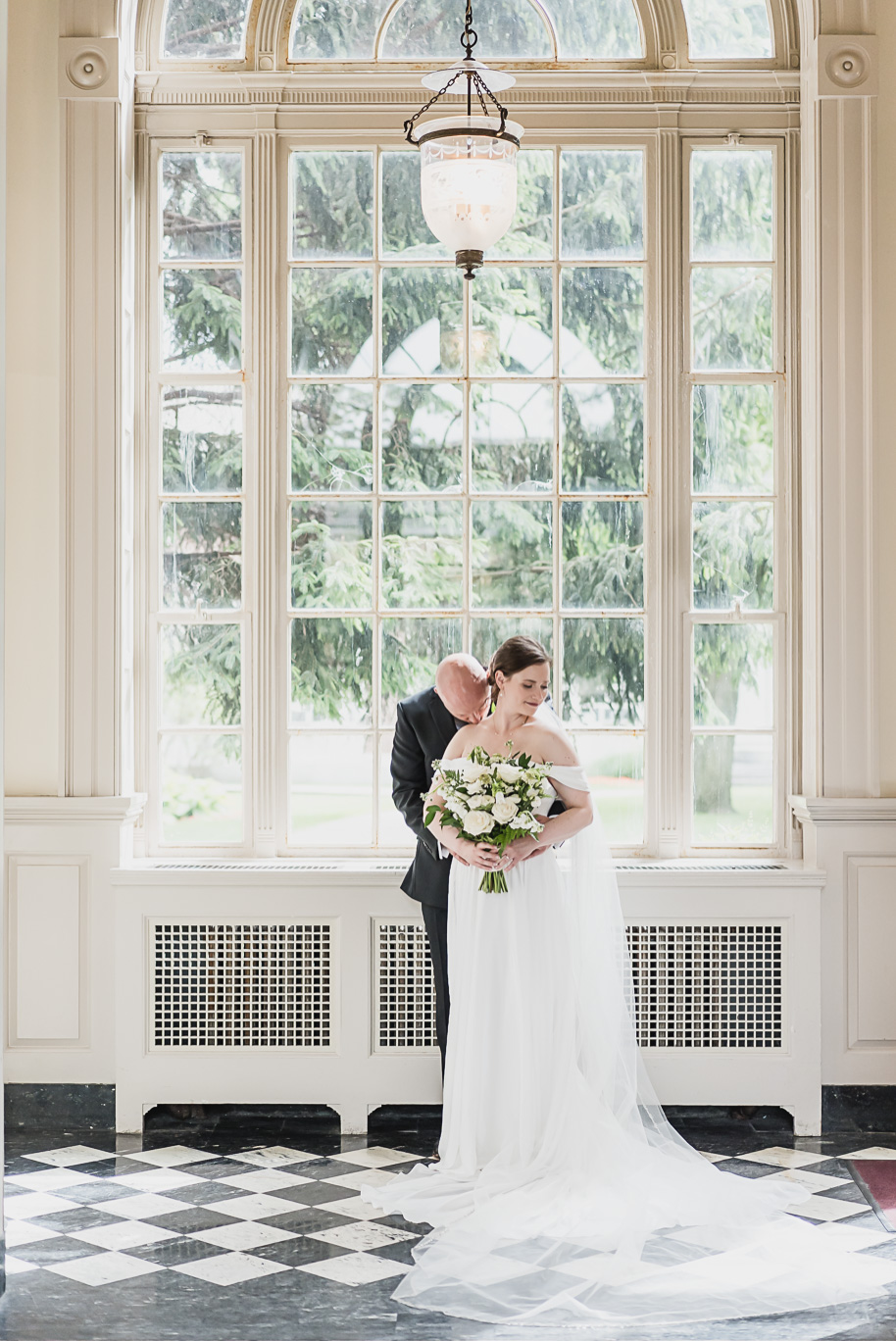 A spring black and white Lovett Hall wedding at Greenfield Village in Dearborn, Michigan provided by Kari Dawson Photography.