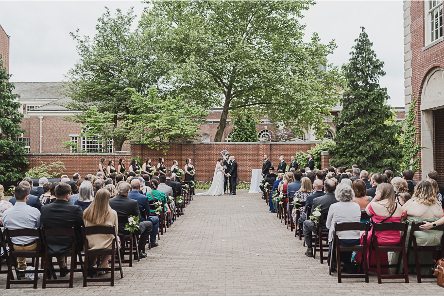 A spring black and white Lovett Hall wedding at Greenfield Village in Dearborn, Michigan provided by Kari Dawson Photography.