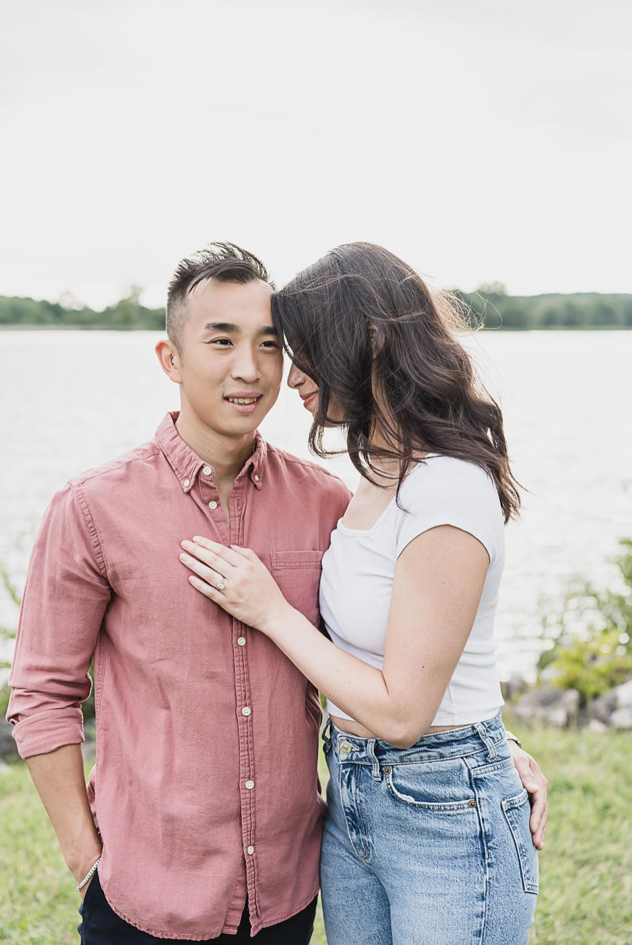 A summer Stony Creek engagement session on the water in Washington, Michigan provided by top-rated Michigan wedding photographer, Kari Dawson.