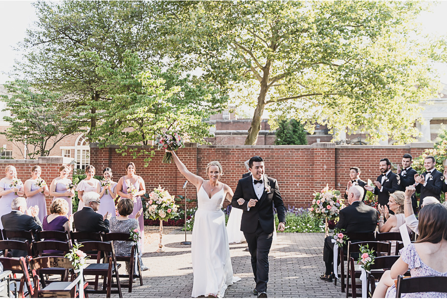 A sunny summer pastel color palette Lovett Hall wedding in Dearborn, Michigan at Greenfield Village provided by Kari Dawson.