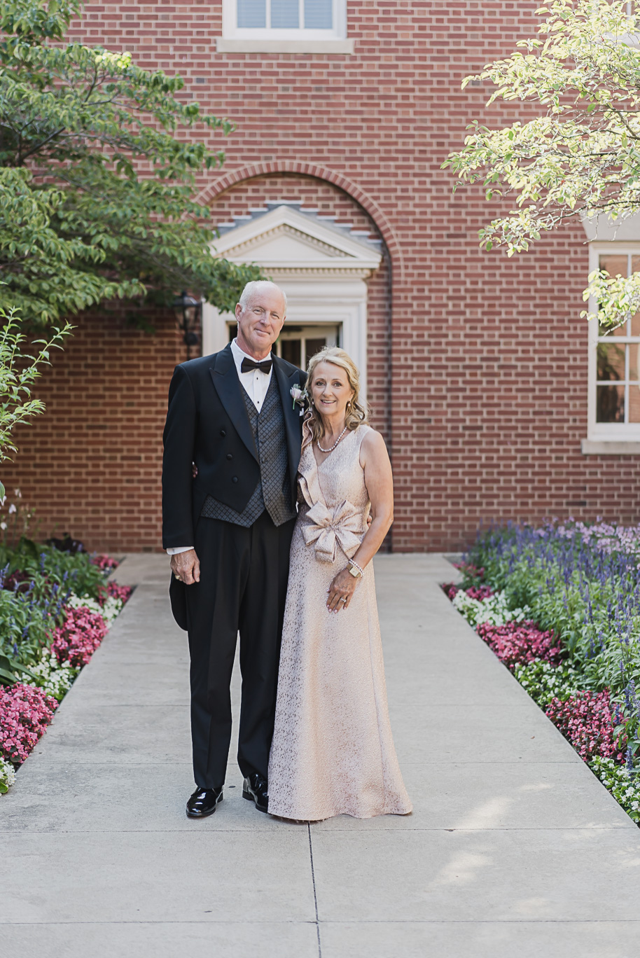 A sunny summer pastel color palette Lovett Hall wedding in Dearborn, Michigan at Greenfield Village provided by Kari Dawson.