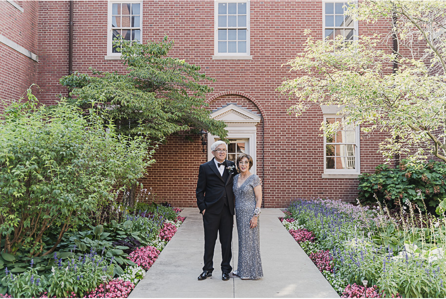 A sunny summer pastel color palette Lovett Hall wedding in Dearborn, Michigan at Greenfield Village provided by Kari Dawson.