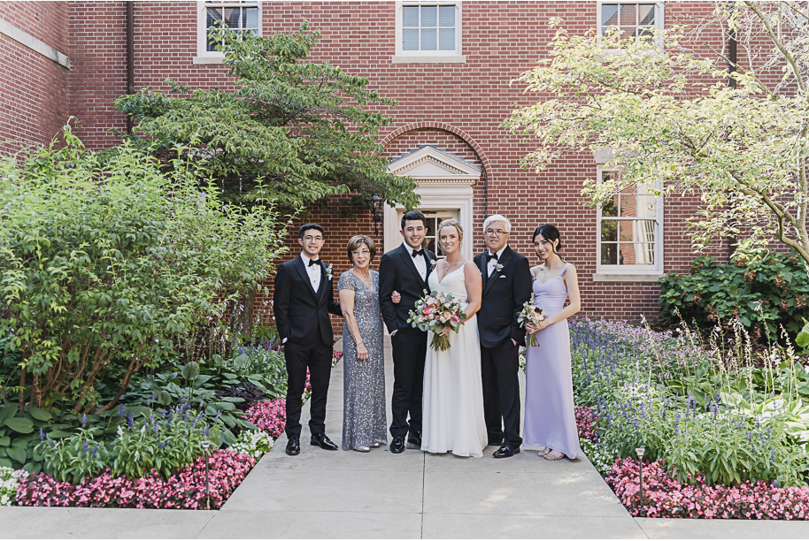 A sunny summer pastel color palette Lovett Hall wedding in Dearborn, Michigan at Greenfield Village provided by Kari Dawson.