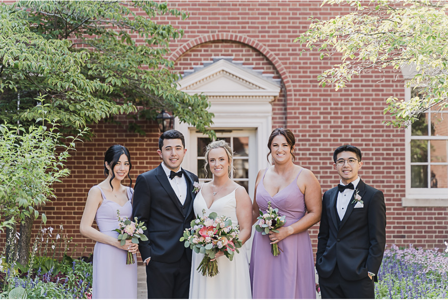 A sunny summer pastel color palette Lovett Hall wedding in Dearborn, Michigan at Greenfield Village provided by Kari Dawson.