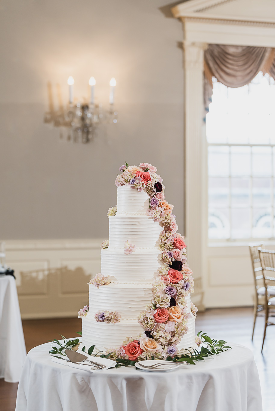 A sunny summer pastel color palette Lovett Hall wedding in Dearborn, Michigan at Greenfield Village provided by Kari Dawson.