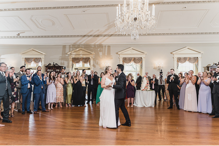 A sunny summer pastel color palette Lovett Hall wedding in Dearborn, Michigan at Greenfield Village provided by Kari Dawson.