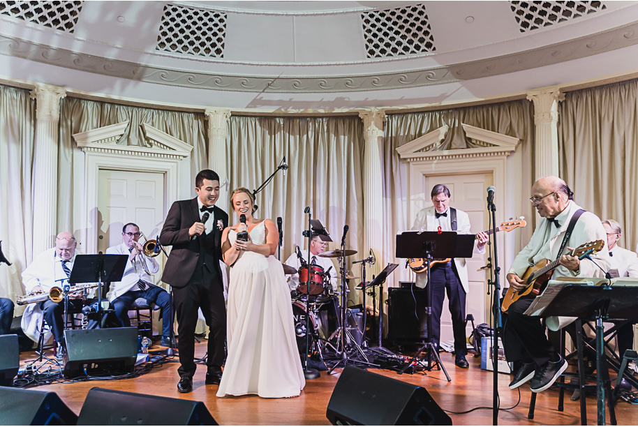 A sunny summer pastel color palette Lovett Hall wedding in Dearborn, Michigan at Greenfield Village provided by Kari Dawson.