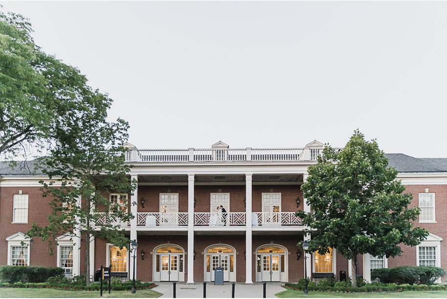 A sunny summer pastel color palette Lovett Hall wedding in Dearborn, Michigan at Greenfield Village provided by Kari Dawson.