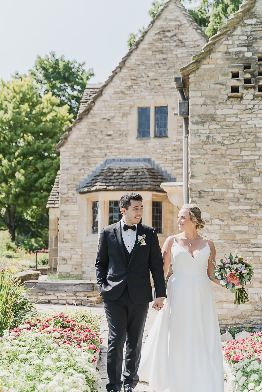 A sunny summer pastel color palette Lovett Hall wedding in Dearborn, Michigan at Greenfield Village provided by Kari Dawson.