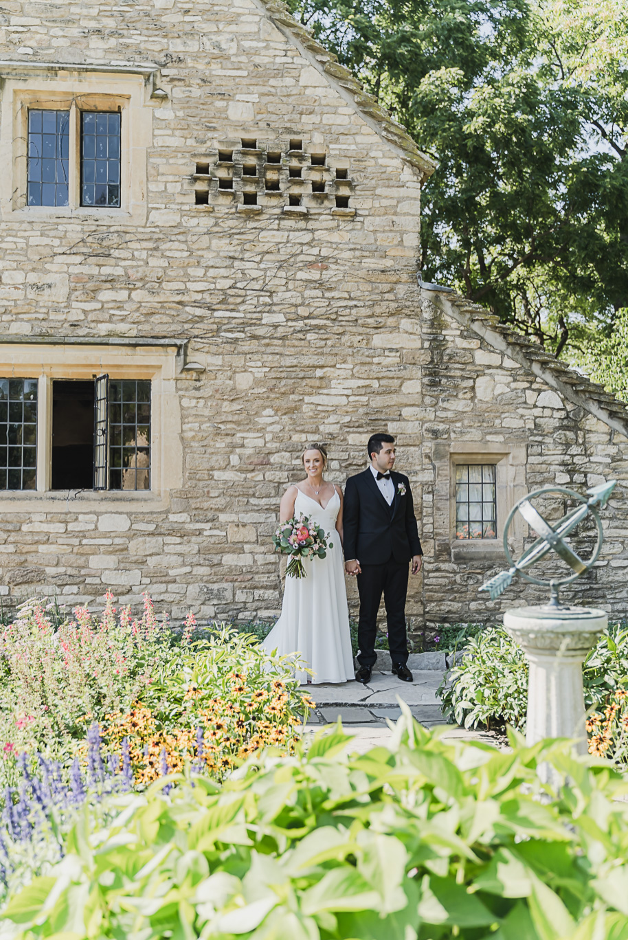 A sunny summer pastel color palette Lovett Hall wedding in Dearborn, Michigan at Greenfield Village provided by Kari Dawson.