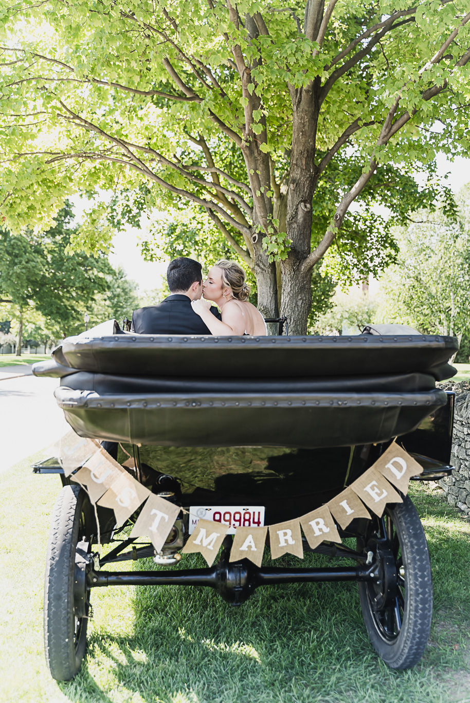 A sunny summer pastel color palette Lovett Hall wedding in Dearborn, Michigan at Greenfield Village provided by Kari Dawson.