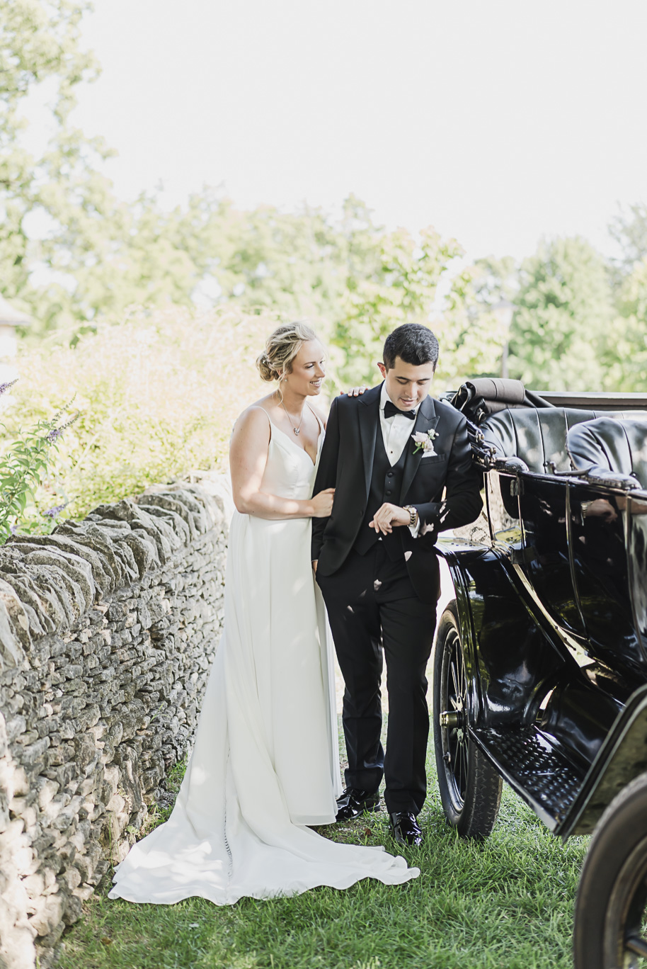 A sunny summer pastel color palette Lovett Hall wedding in Dearborn, Michigan at Greenfield Village provided by Kari Dawson.