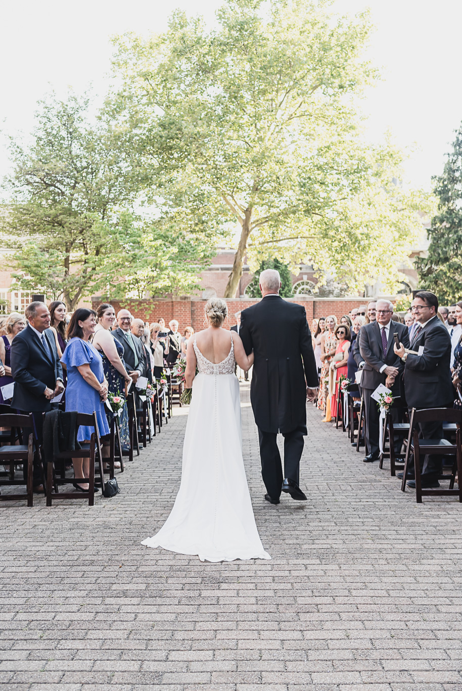 A sunny summer pastel color palette Lovett Hall wedding in Dearborn, Michigan at Greenfield Village provided by Kari Dawson.