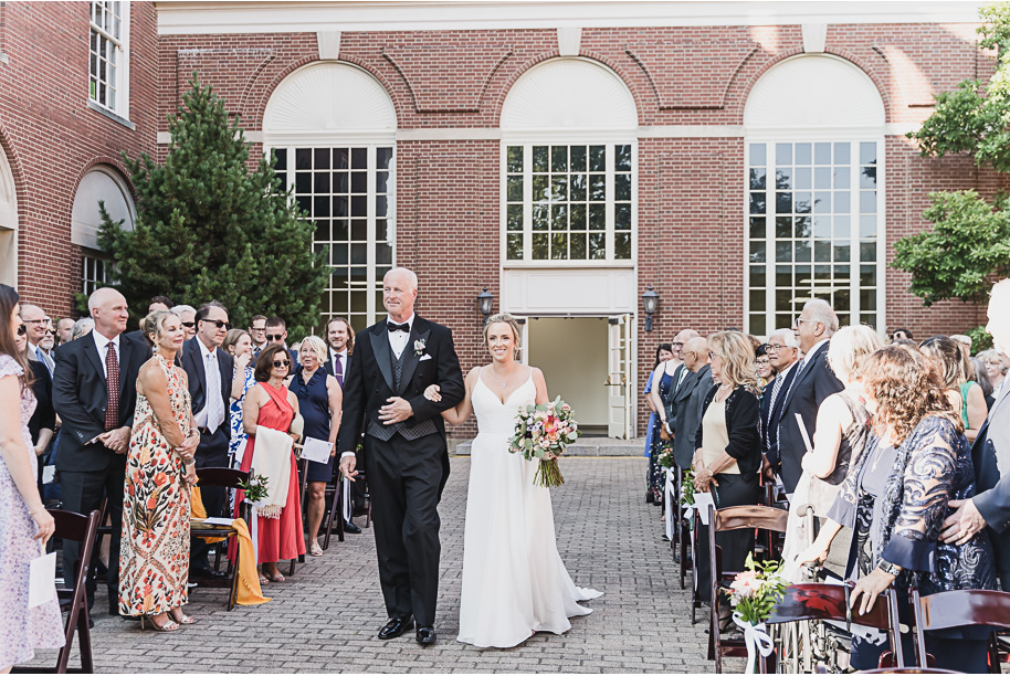 A sunny summer pastel color palette Lovett Hall wedding in Dearborn, Michigan at Greenfield Village provided by Kari Dawson.