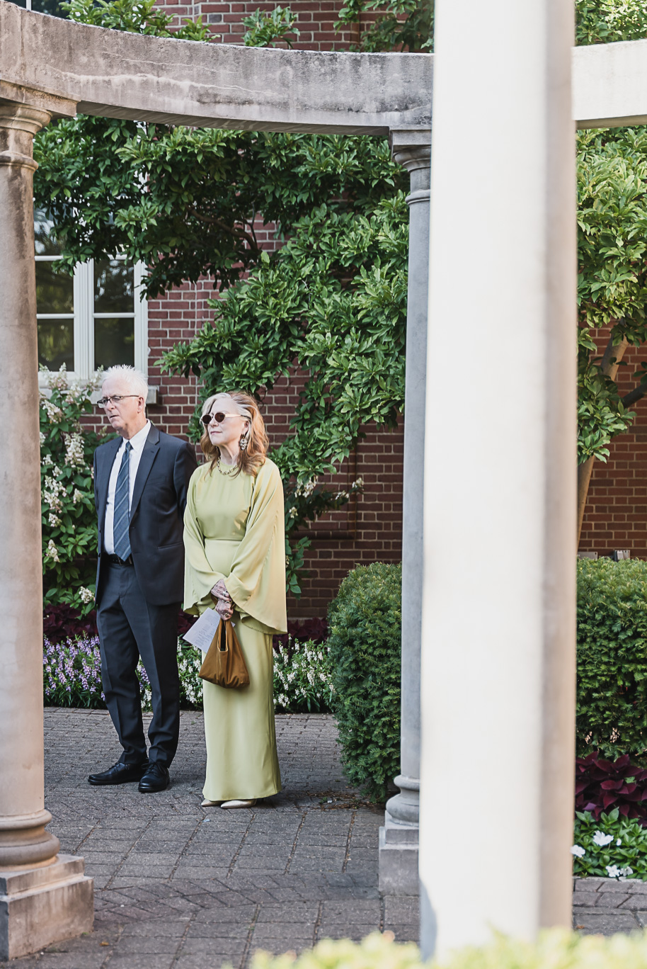 A sunny summer pastel color palette Lovett Hall wedding in Dearborn, Michigan at Greenfield Village provided by Kari Dawson.