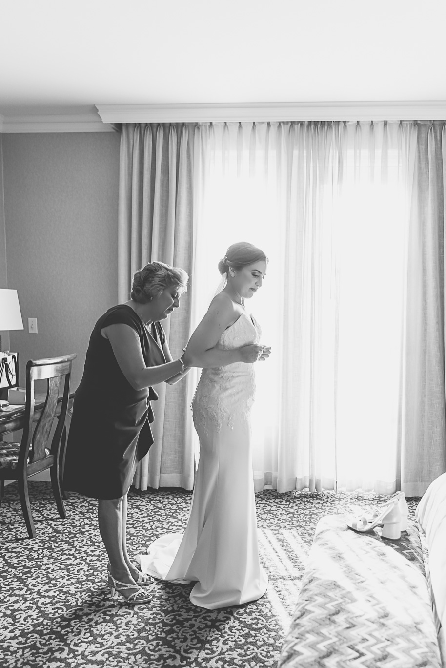 A romantic late summer intimate wedding at the Royal Park Hotel in Rochester, Michigan provided by top-rated Rochester wedding photograher Kari Dawson and her team.