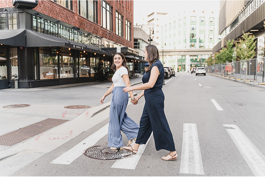 A same sex downtown Detroit engagement session in the summer provided by top-rated Detroit wedding photographer Kari Dawson.