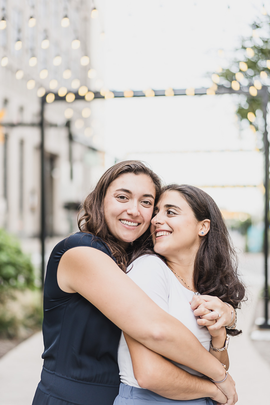 A same sex downtown Detroit engagement session in the summer provided by top-rated Detroit wedding photographer Kari Dawson.