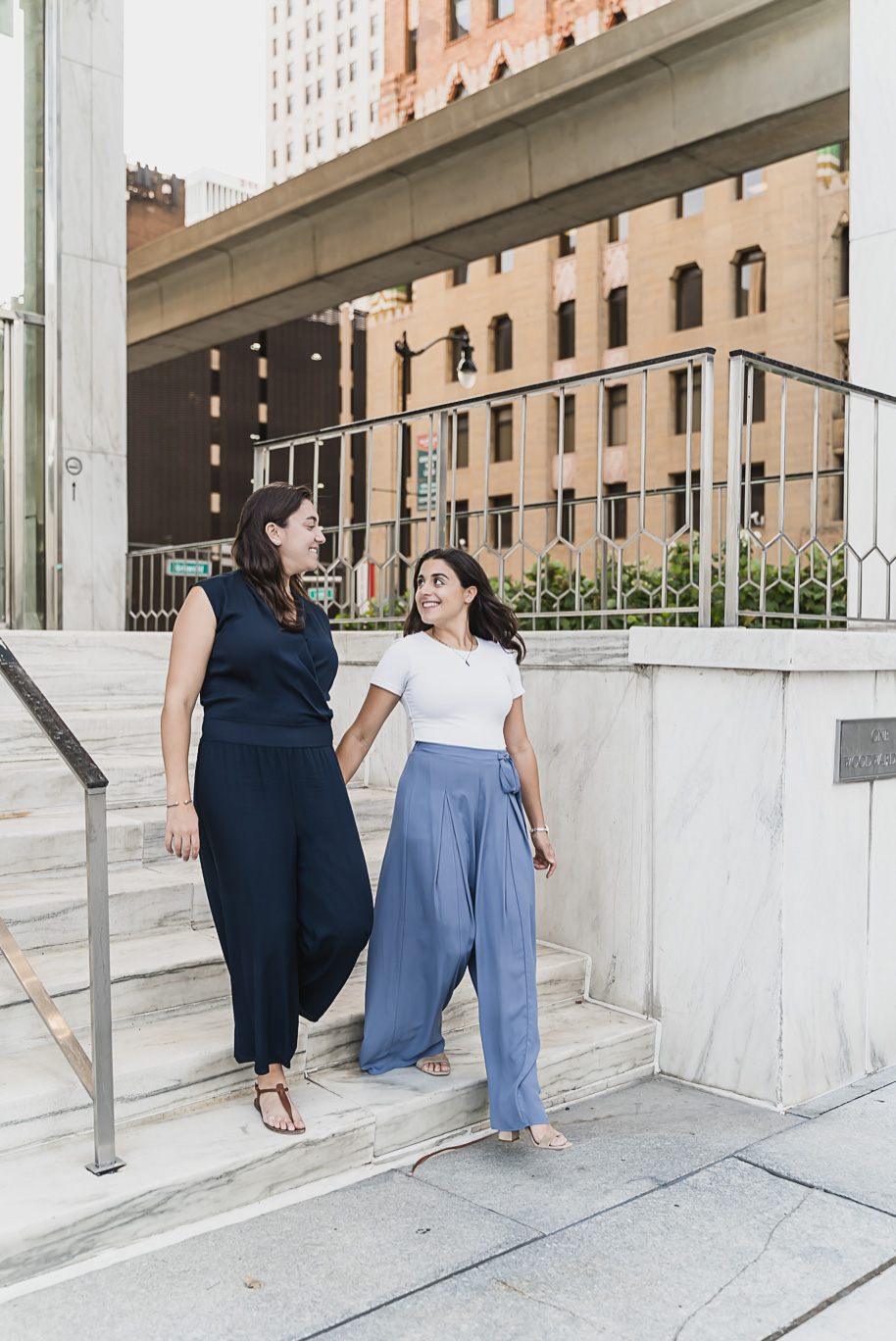 A same sex downtown Detroit engagement session in the summer provided by top-rated Detroit wedding photographer Kari Dawson.