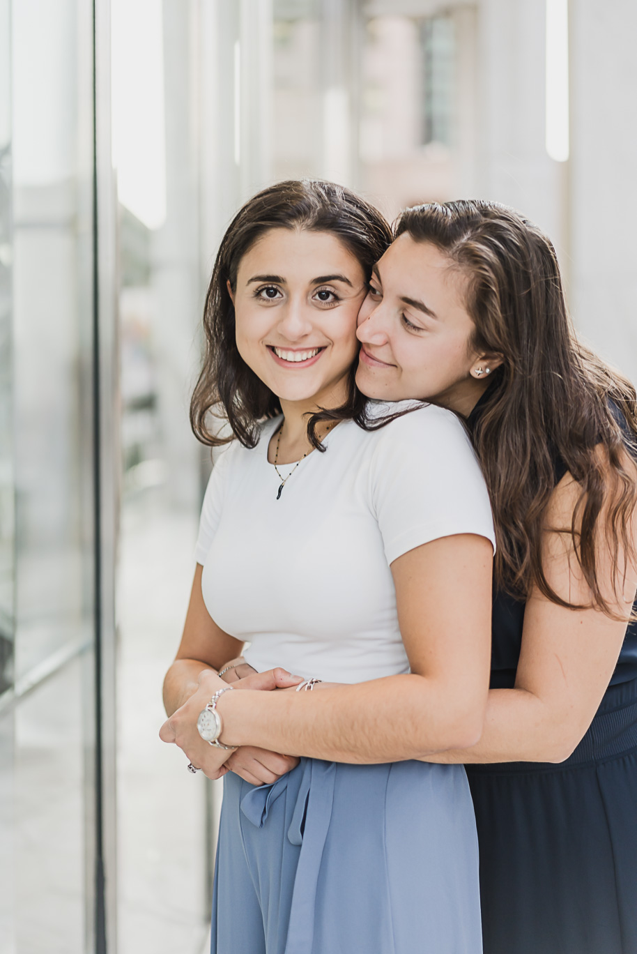 A same sex downtown Detroit engagement session in the summer provided by top-rated Detroit wedding photographer Kari Dawson.