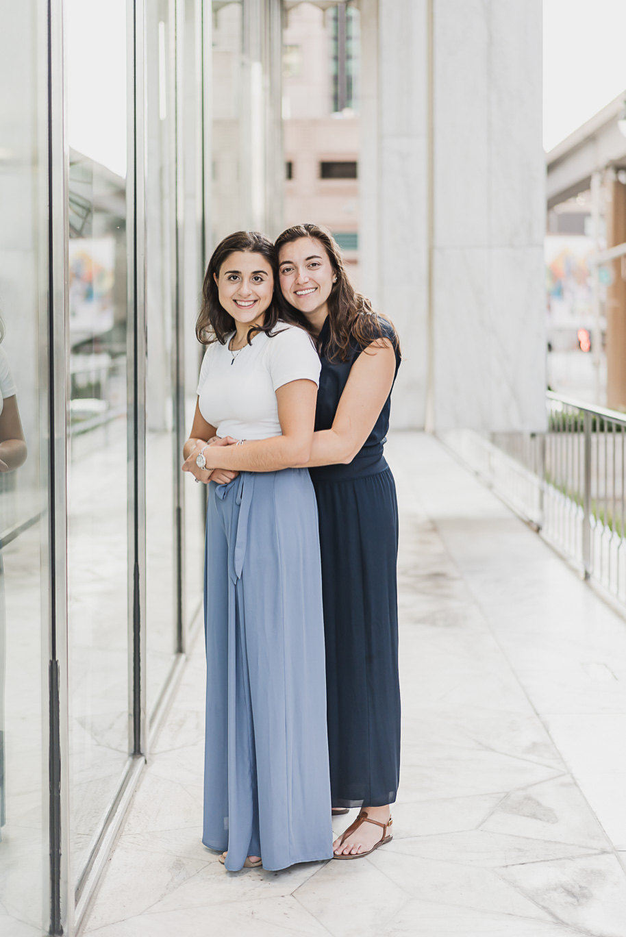 A same sex downtown Detroit engagement session in the summer provided by top-rated Detroit wedding photographer Kari Dawson.