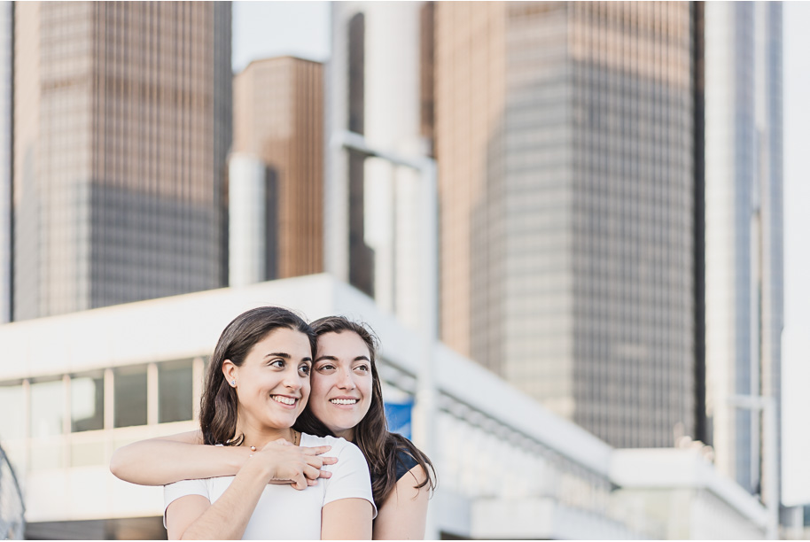 A same sex downtown Detroit engagement session in the summer provided by top-rated Detroit wedding photographer Kari Dawson.