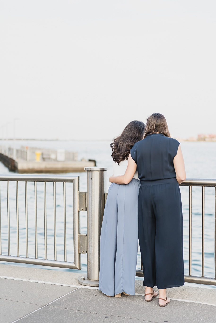 A same sex downtown Detroit engagement session in the summer provided by top-rated Detroit wedding photographer Kari Dawson.