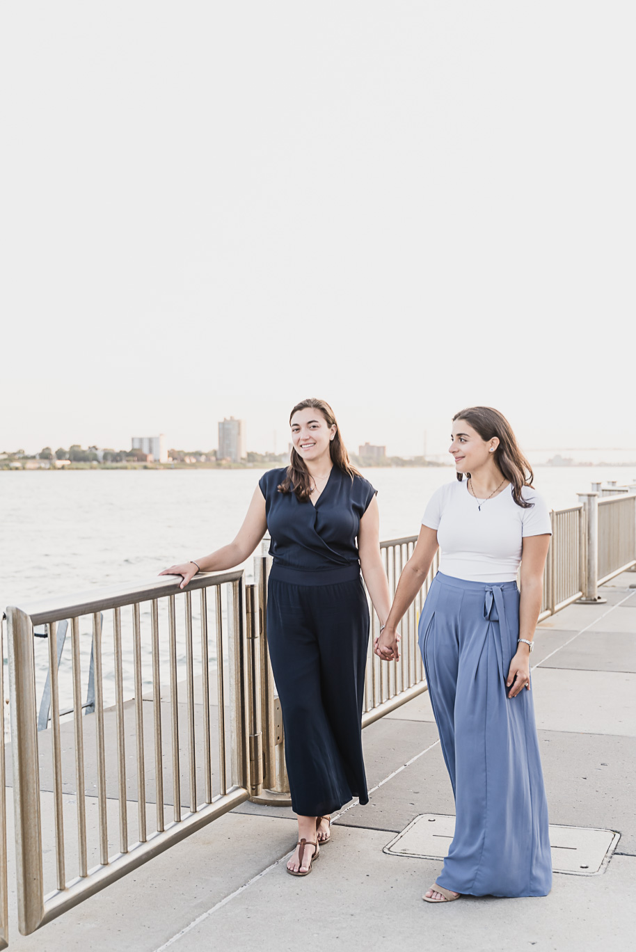 A same sex downtown Detroit engagement session in the summer provided by top-rated Detroit wedding photographer Kari Dawson.