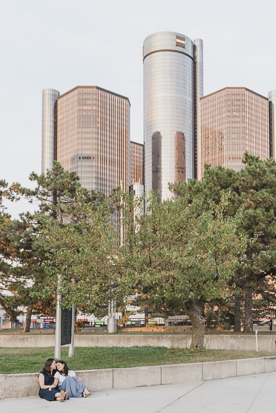 A same sex downtown Detroit engagement session in the summer provided by top-rated Detroit wedding photographer Kari Dawson.