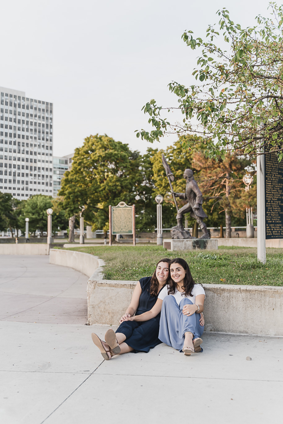 A same sex downtown Detroit engagement session in the summer provided by top-rated Detroit wedding photographer Kari Dawson.