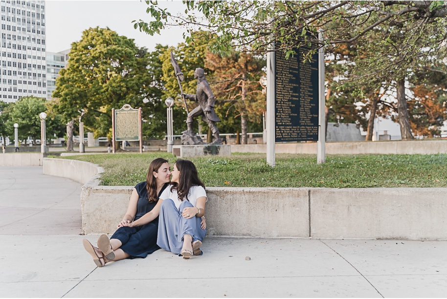 A same sex downtown Detroit engagement session in the summer provided by top-rated Detroit wedding photographer Kari Dawson.