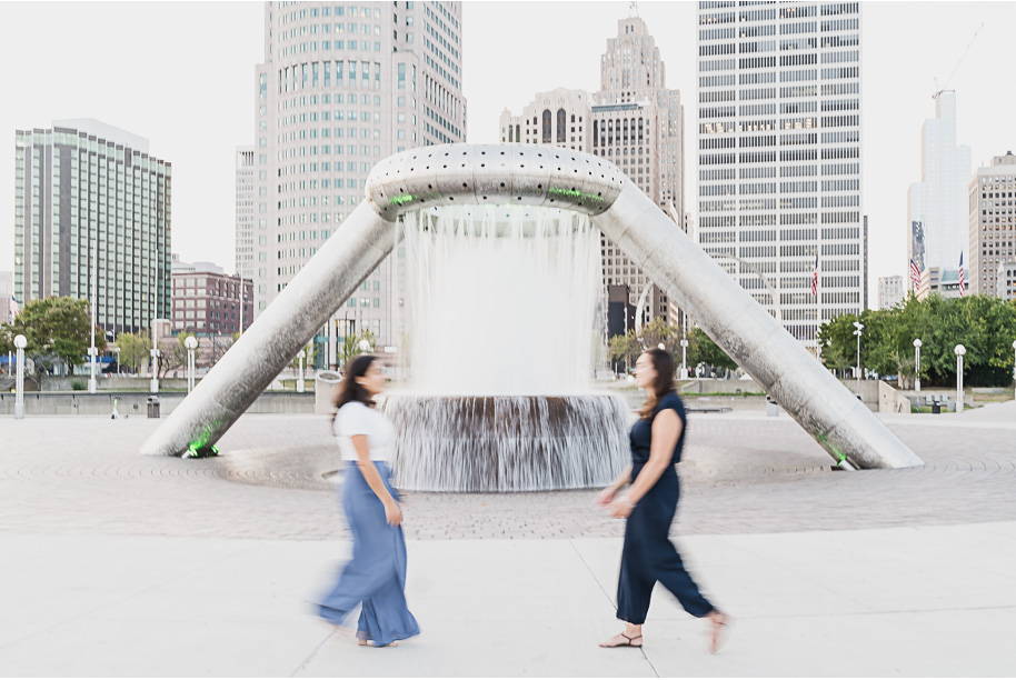 A same sex downtown Detroit engagement session in the summer provided by top-rated Detroit wedding photographer Kari Dawson.