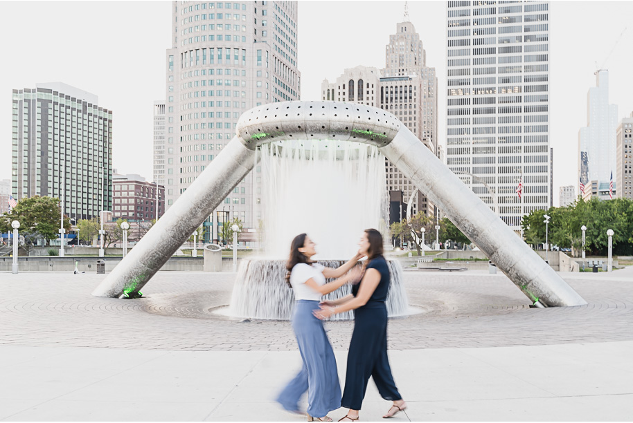 A same sex downtown Detroit engagement session in the summer provided by top-rated Detroit wedding photographer Kari Dawson.