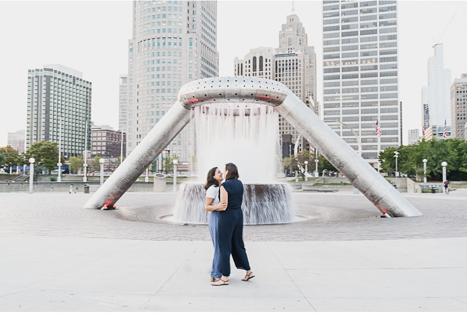 A same sex downtown Detroit engagement session in the summer provided by top-rated Detroit wedding photographer Kari Dawson.