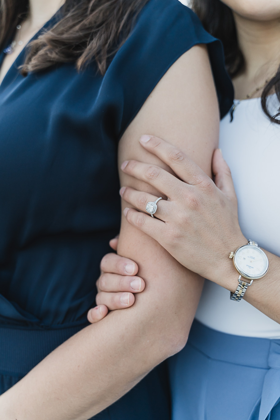 A same sex downtown Detroit engagement session in the summer provided by top-rated Detroit wedding photographer Kari Dawson.