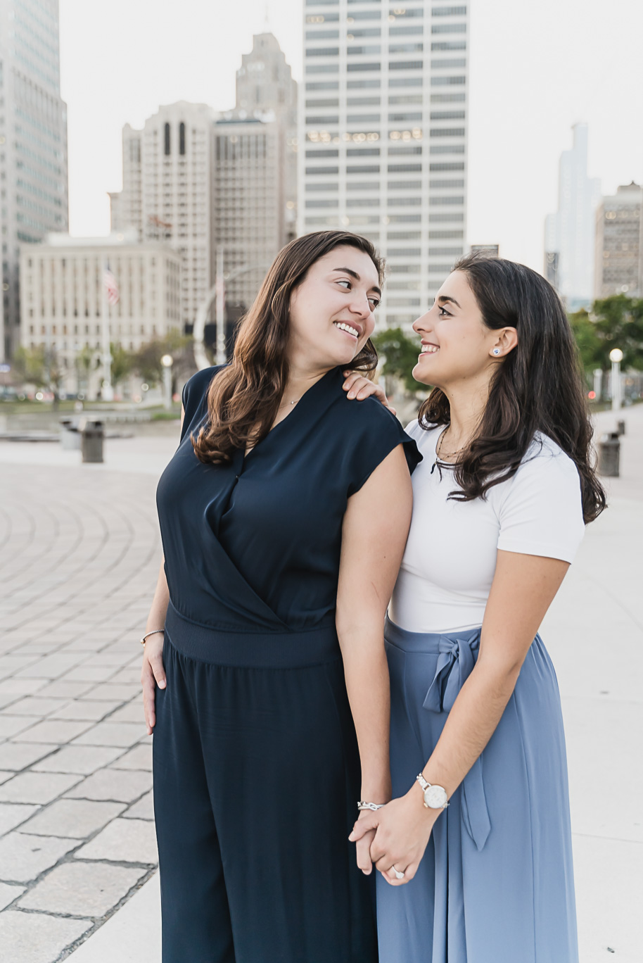 A same sex downtown Detroit engagement session in the summer provided by top-rated Detroit wedding photographer Kari Dawson.