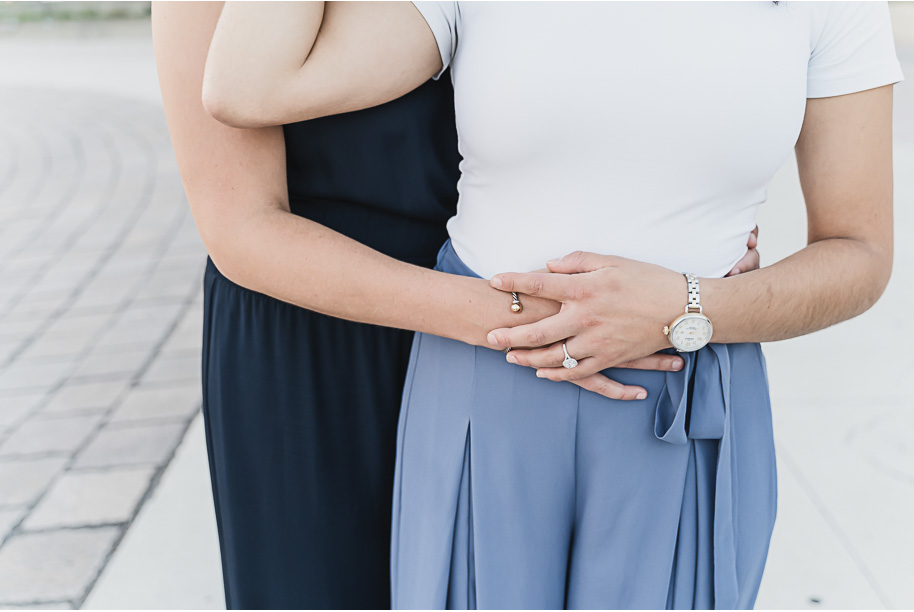 A same sex downtown Detroit engagement session in the summer provided by top-rated Detroit wedding photographer Kari Dawson.