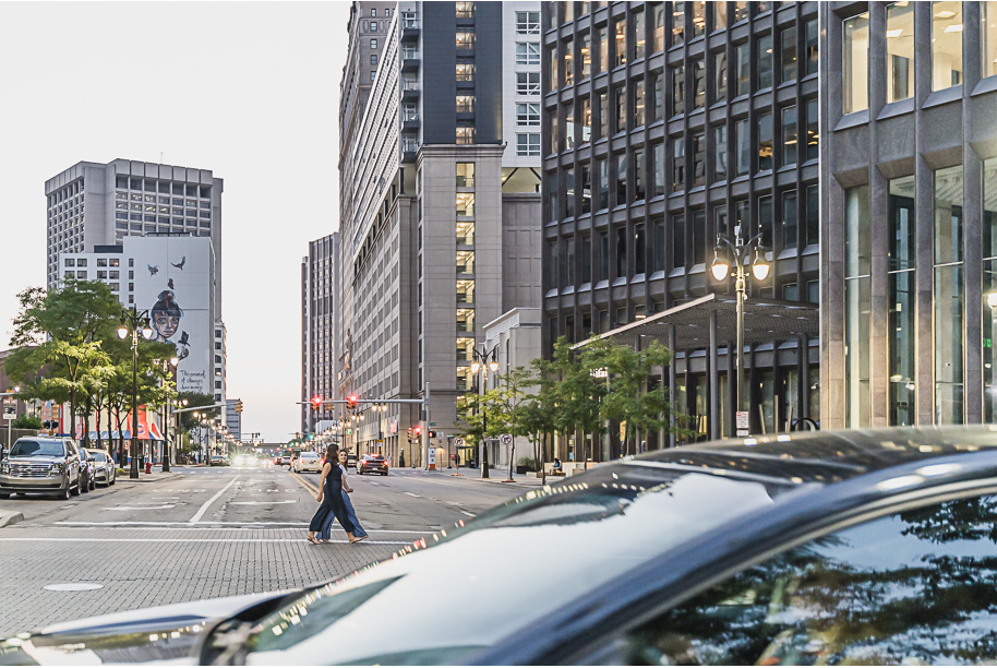 A same sex downtown Detroit engagement session in the summer provided by top-rated Detroit wedding photographer Kari Dawson.