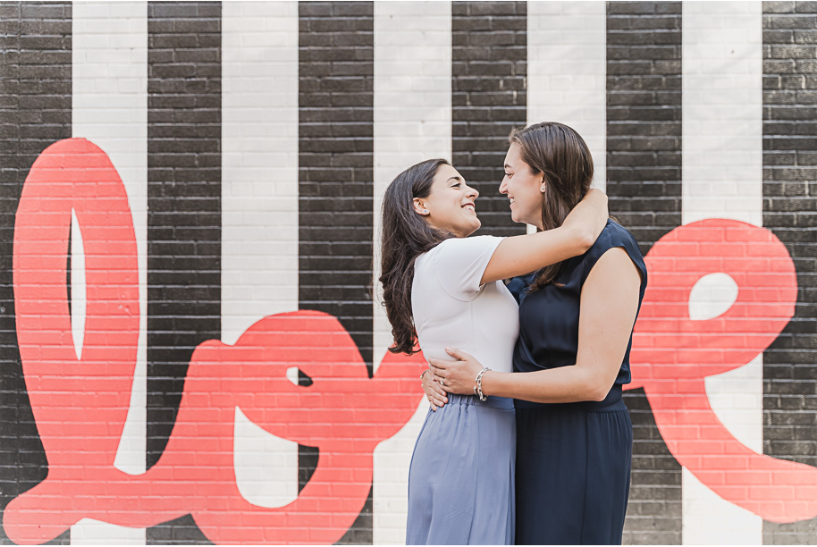 A same sex downtown Detroit engagement session in the summer provided by top-rated Detroit wedding photographer Kari Dawson.