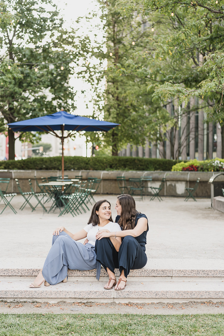 A same sex downtown Detroit engagement session in the summer provided by top-rated Detroit wedding photographer Kari Dawson.