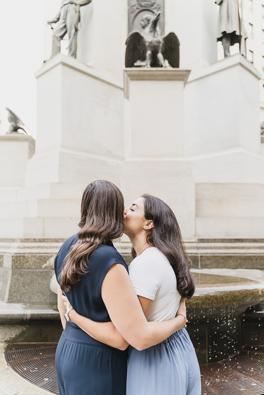 A same sex downtown Detroit engagement session in the summer provided by top-rated Detroit wedding photographer Kari Dawson.