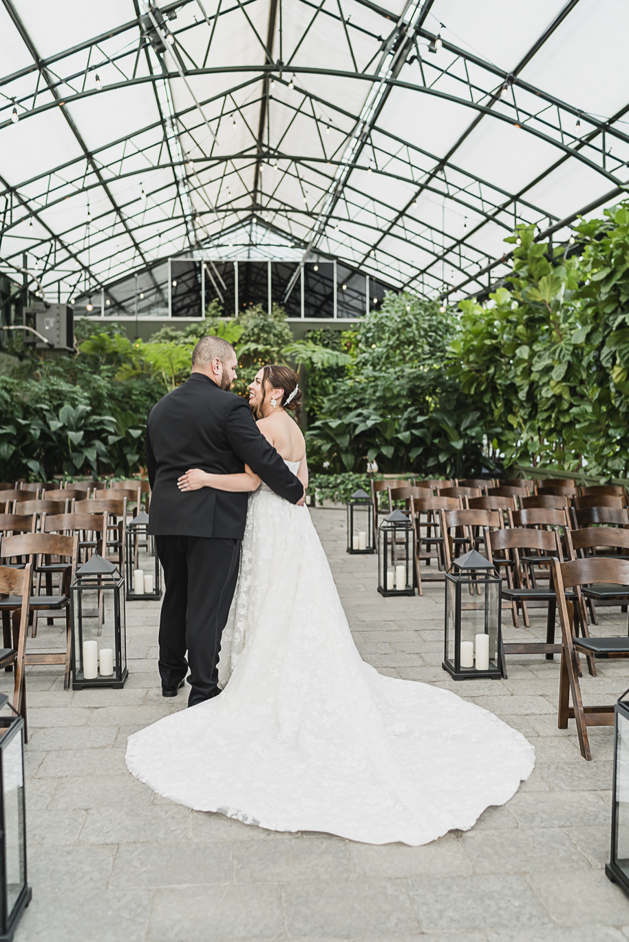 A classic black and white black tie winter Planterra wedding in West Bloomfield, Michigan provided by top-rated Detroit wedding photographer, Kari Dawson and her team.