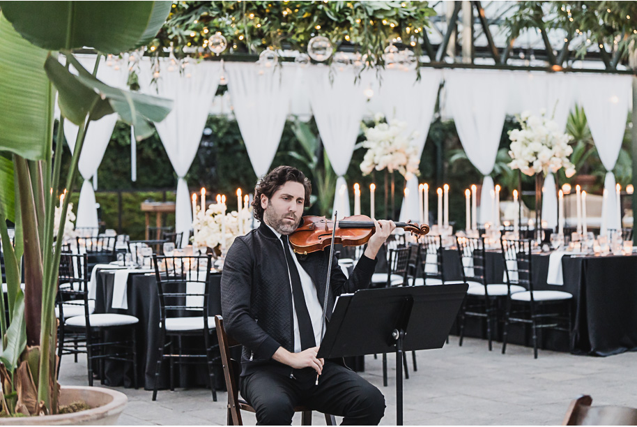 A classic black and white black tie winter Planterra wedding in West Bloomfield, Michigan provided by top-rated Detroit wedding photographer, Kari Dawson and her team.